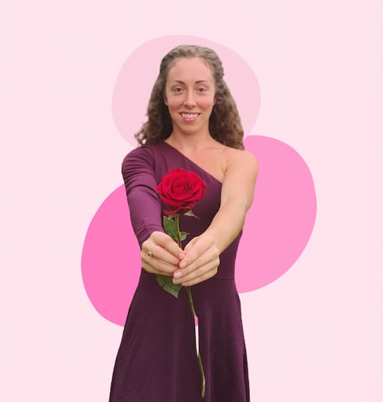 Love with AnnMArie (1) Ann-Marie, the Love Coach, is handing a red rose.